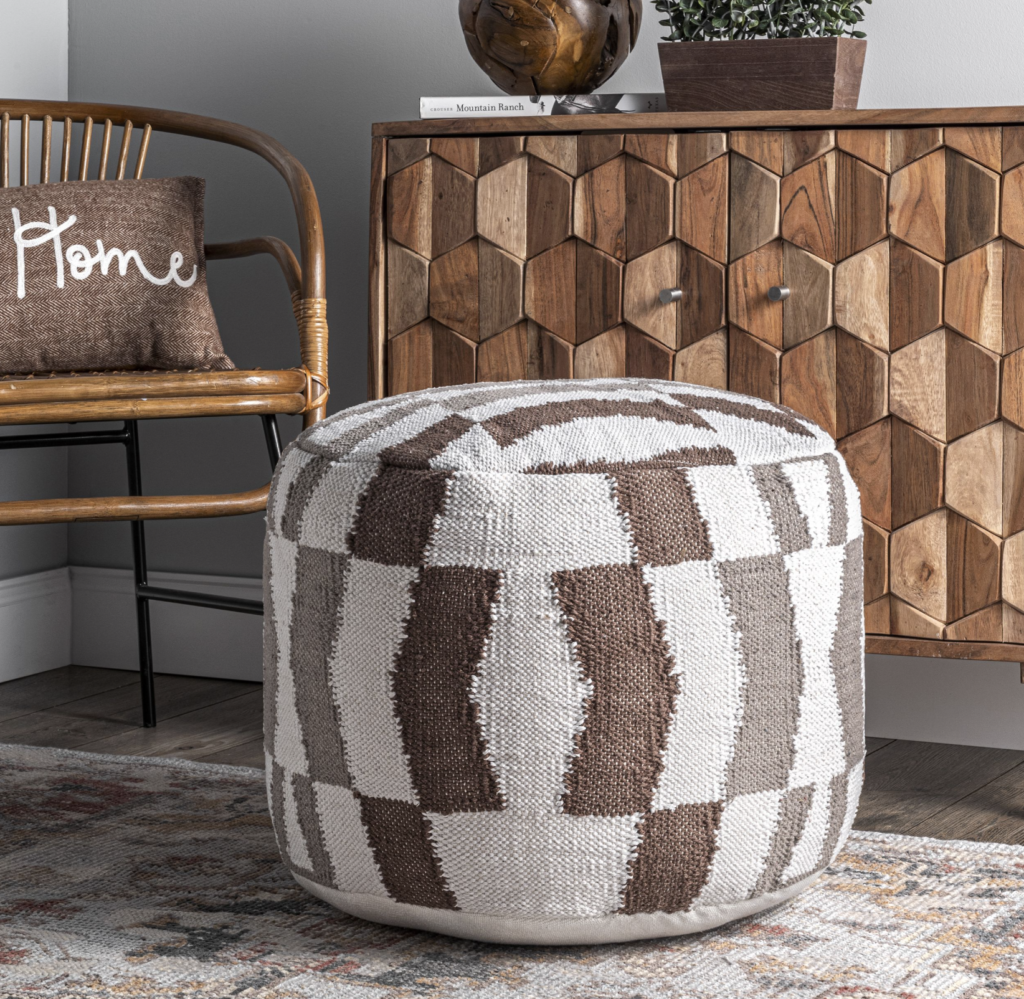 Stylish Flatwoven Herringbone pouf from Rugs USA enhances a living room setup, ideal for Airbnb decor and seating